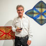 František Skála před svými obrazy v Trafo Gallery.