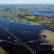 Vědci tvrdí, že svoji roli v neobvyklých deštích - i suchu, která jim předcházela - sehrála klimatická změna.